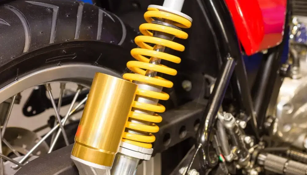 Peredam Benturan Sepeda Motor Pada Komponen Shock
